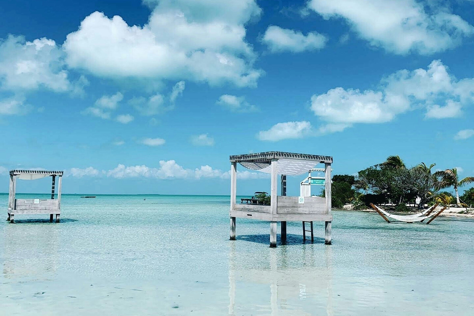 Typical Caribbean water with cabanas, hammocks, palm trees, that can be enjoyed while living in Latin America