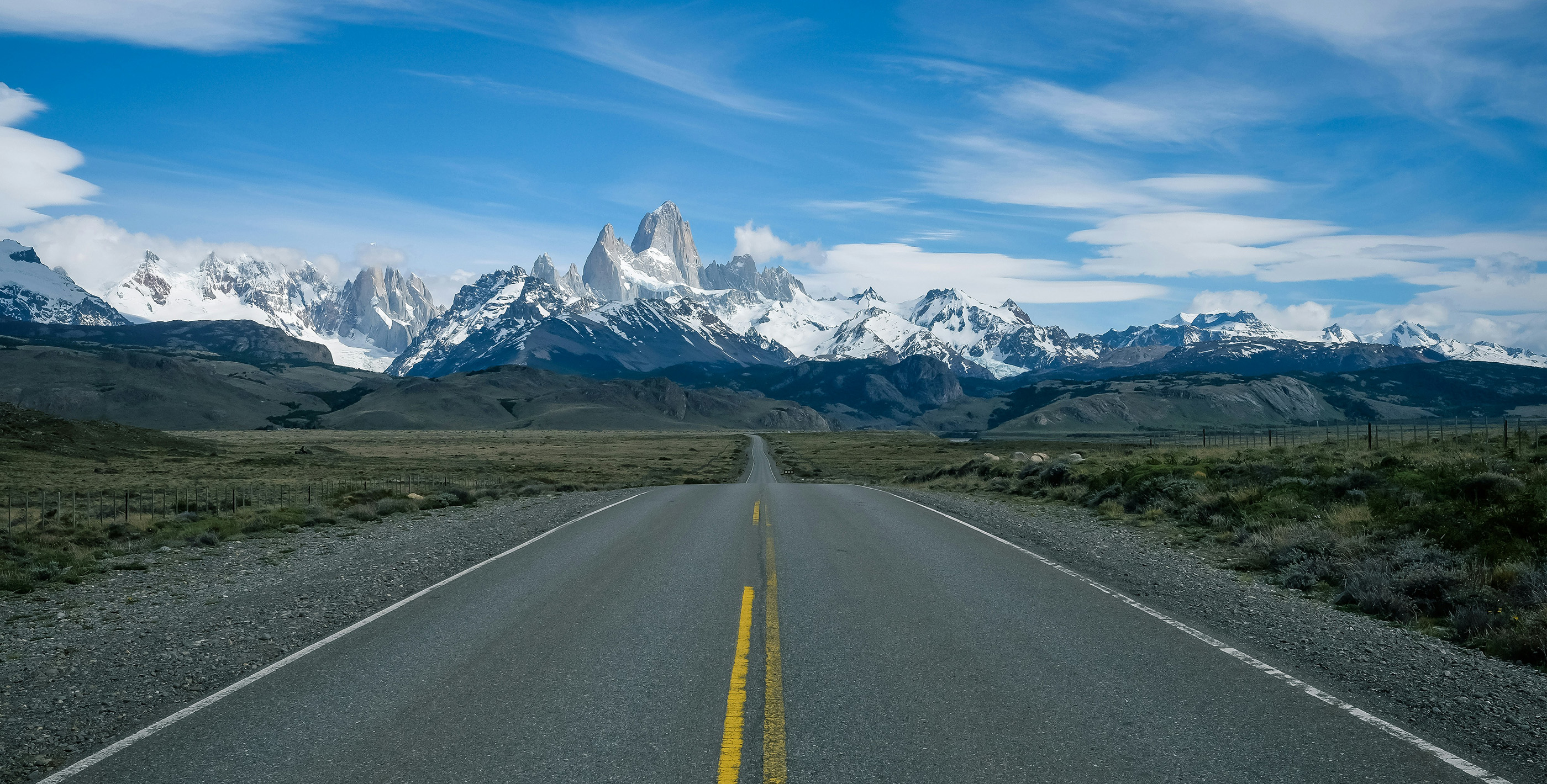 Highway leading to snow-capped mountains in South America