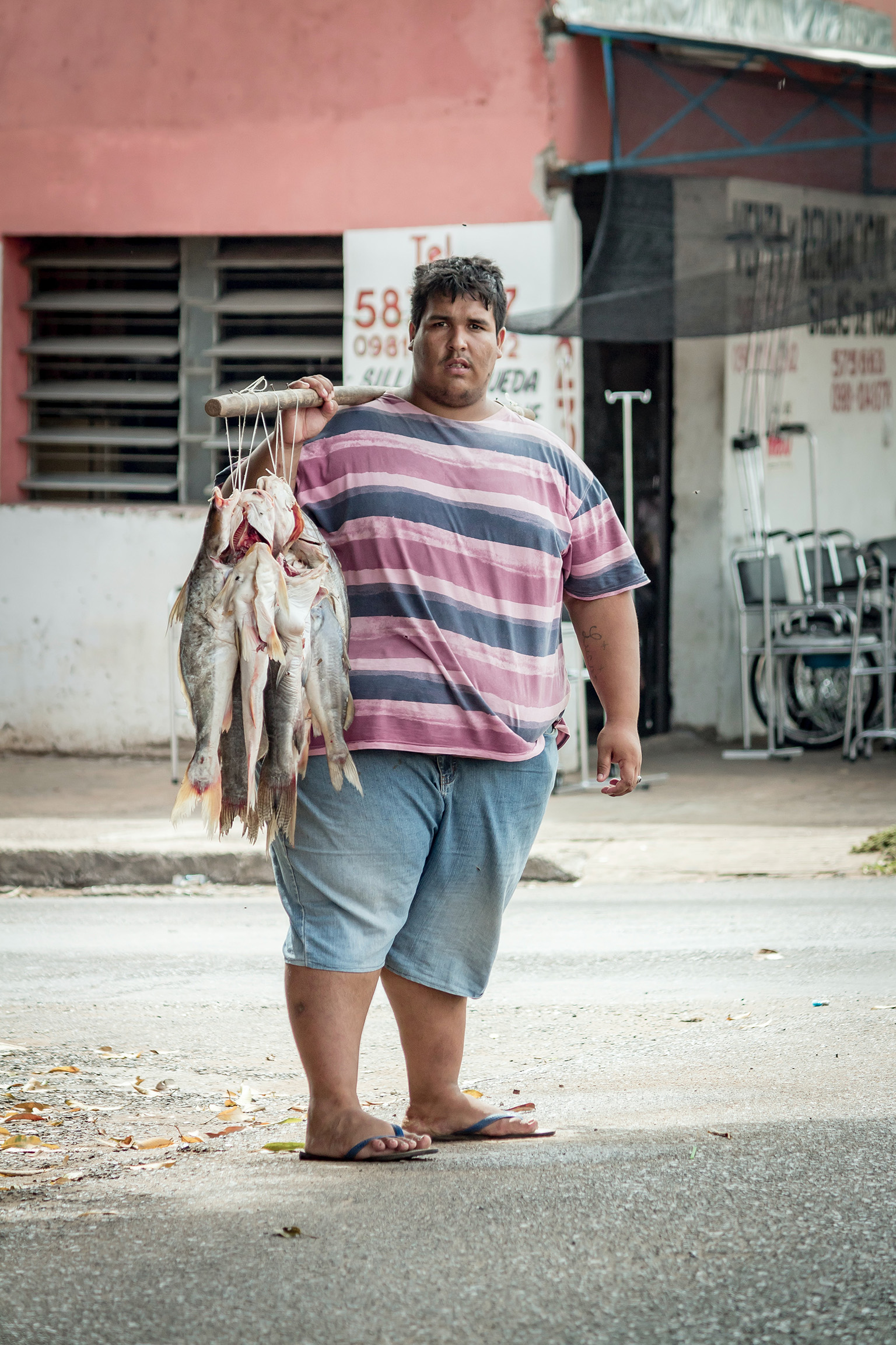 Local fisherman with daily catch near one of the many rivers for sources of food. 