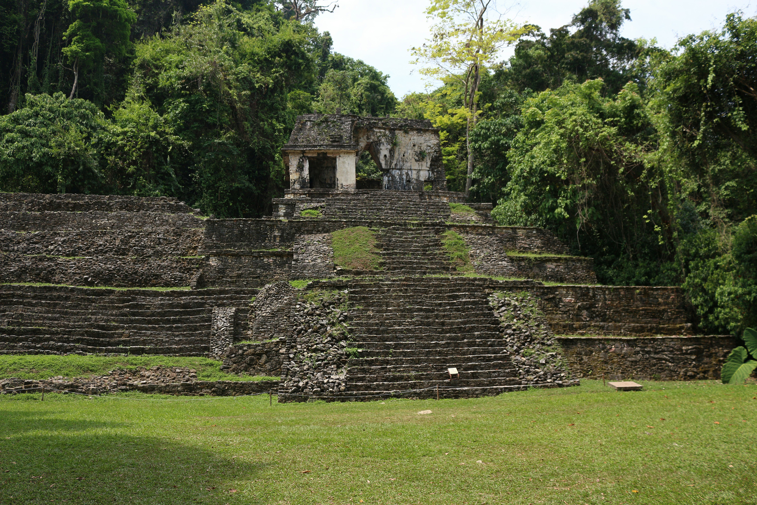 Mayan ruin surrounded by jungle in Palenque, Mexico.