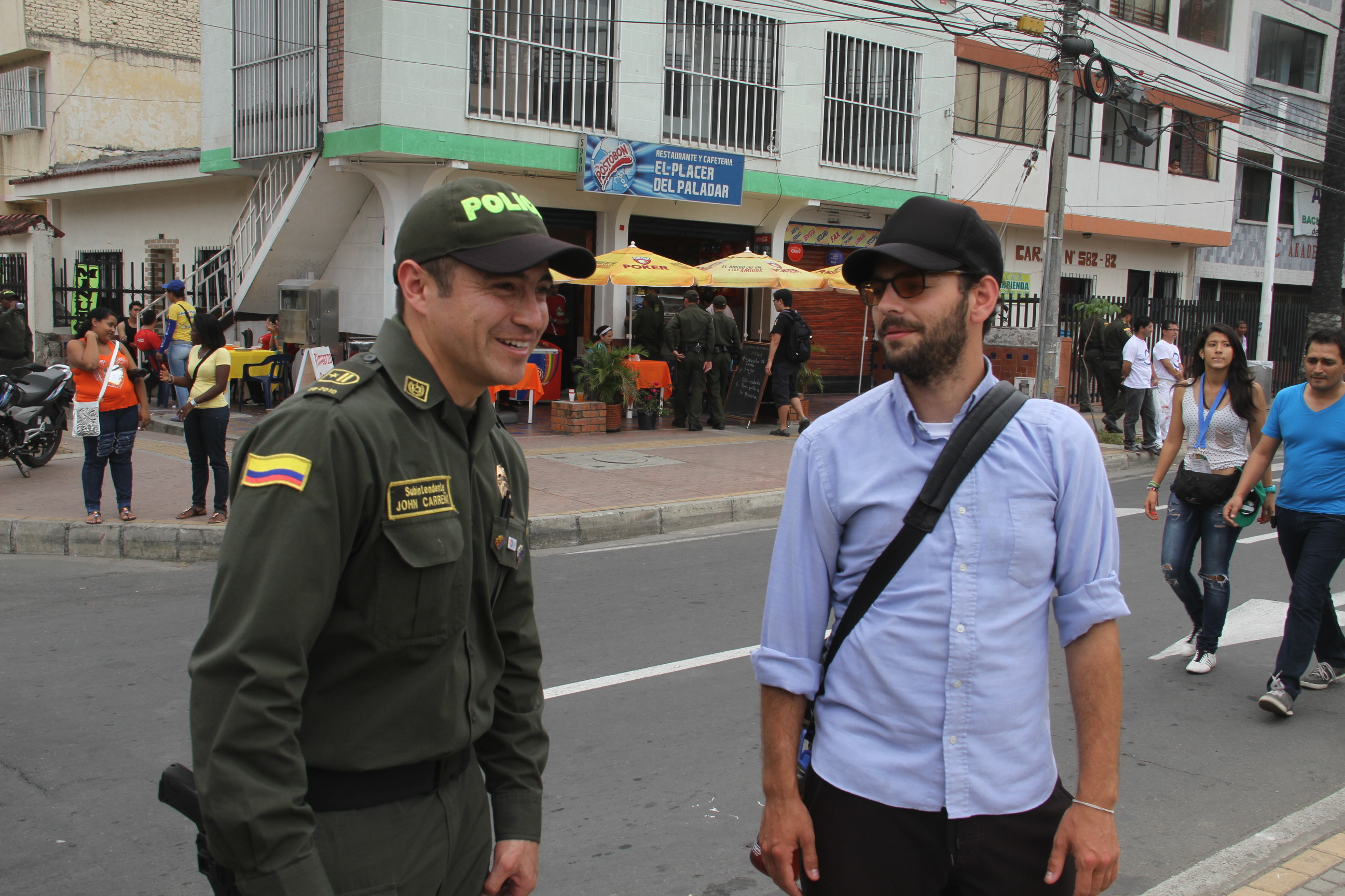 Colombian police talking to an expat in the street.