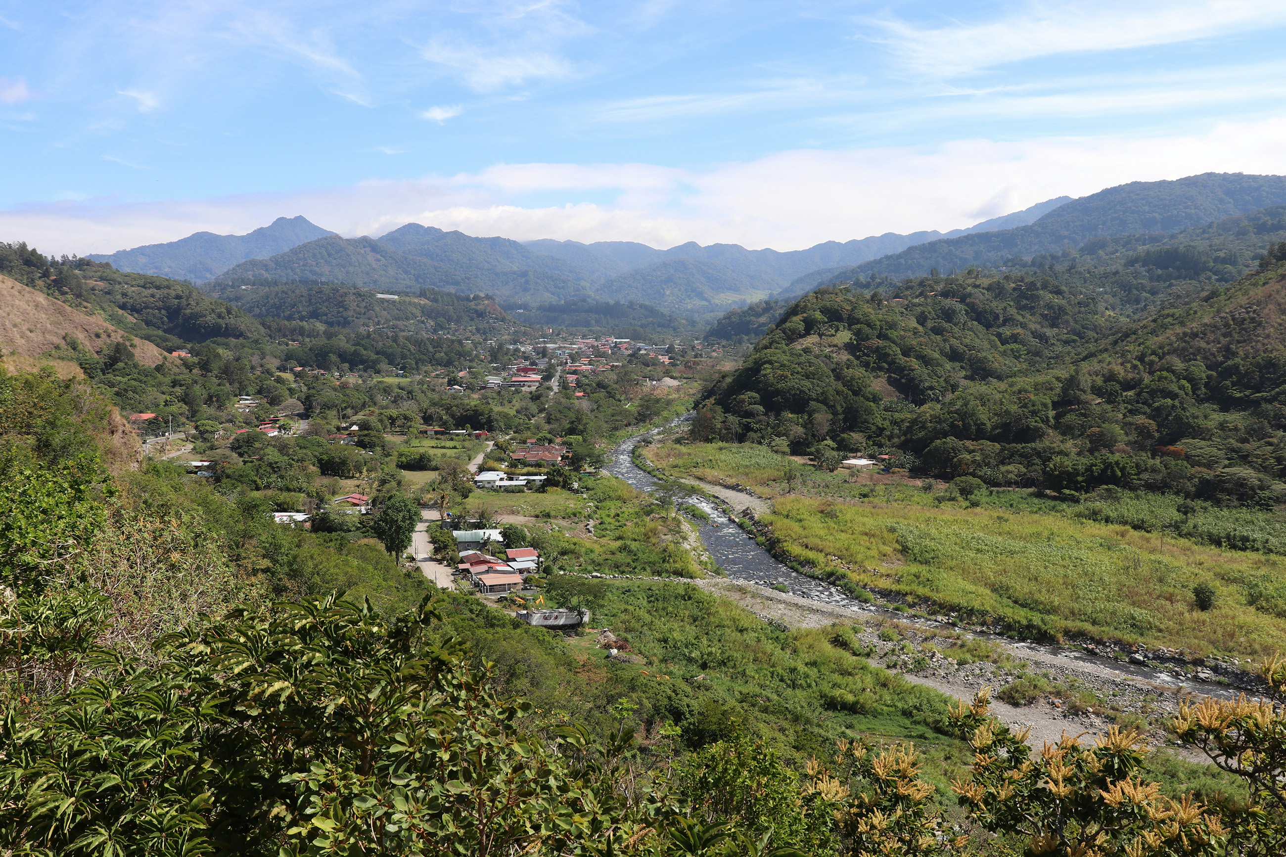 A charming countryside view of the town of Chiriquí, Panama, with rolling green hills and a small-town feel.