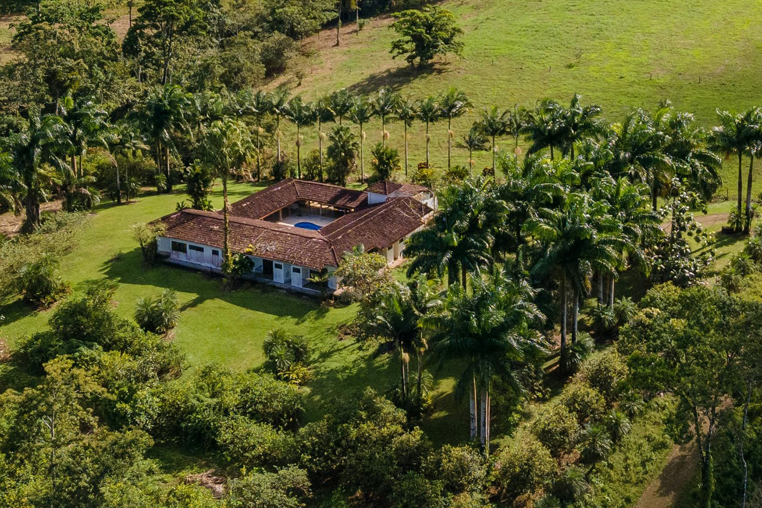 A country house surrounded by lush jungle in Alajuela Province, Costa Rica.