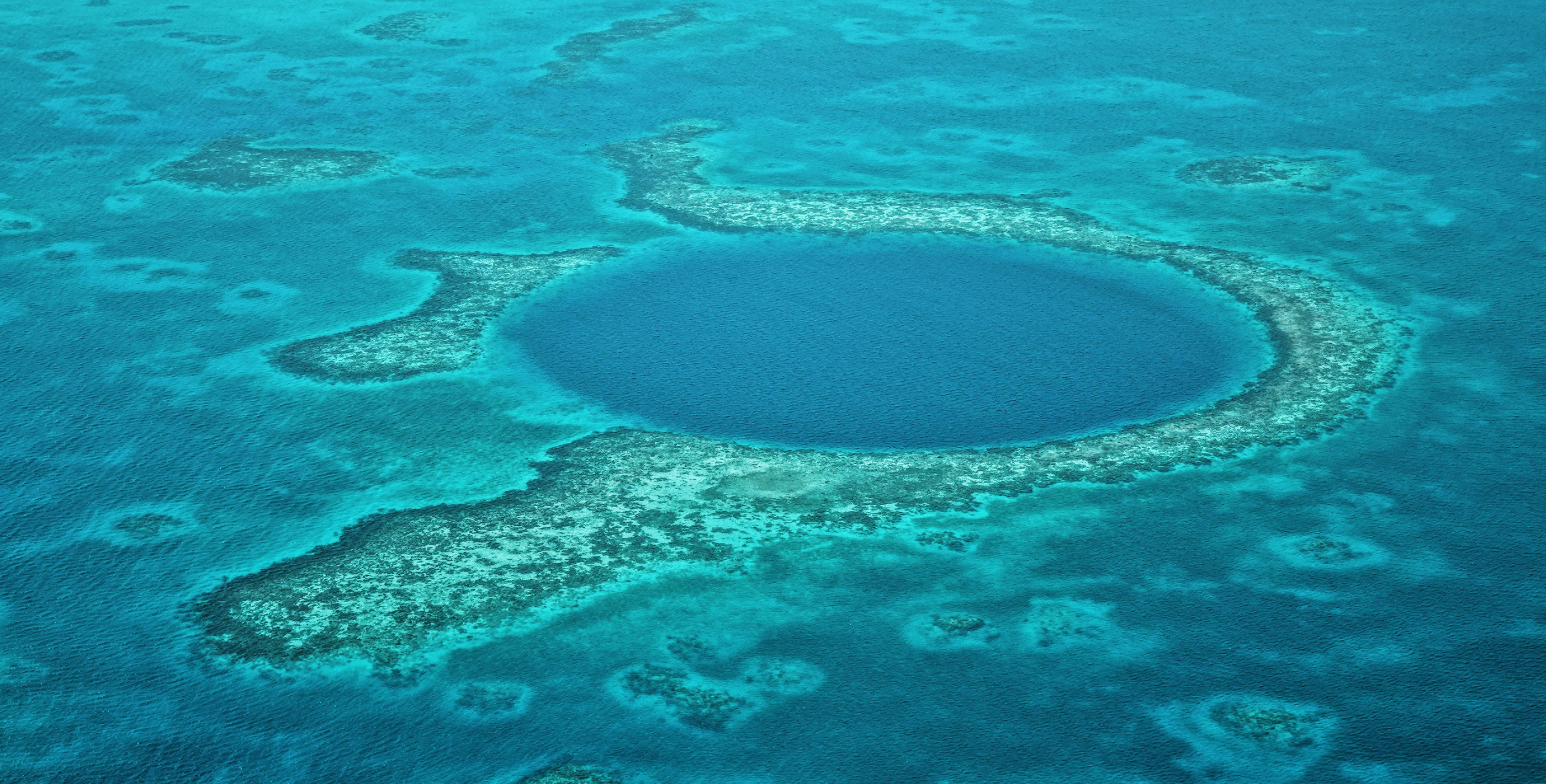 Overhead aerial of the Great Blue Hole off Belize’s coast near San Pedro