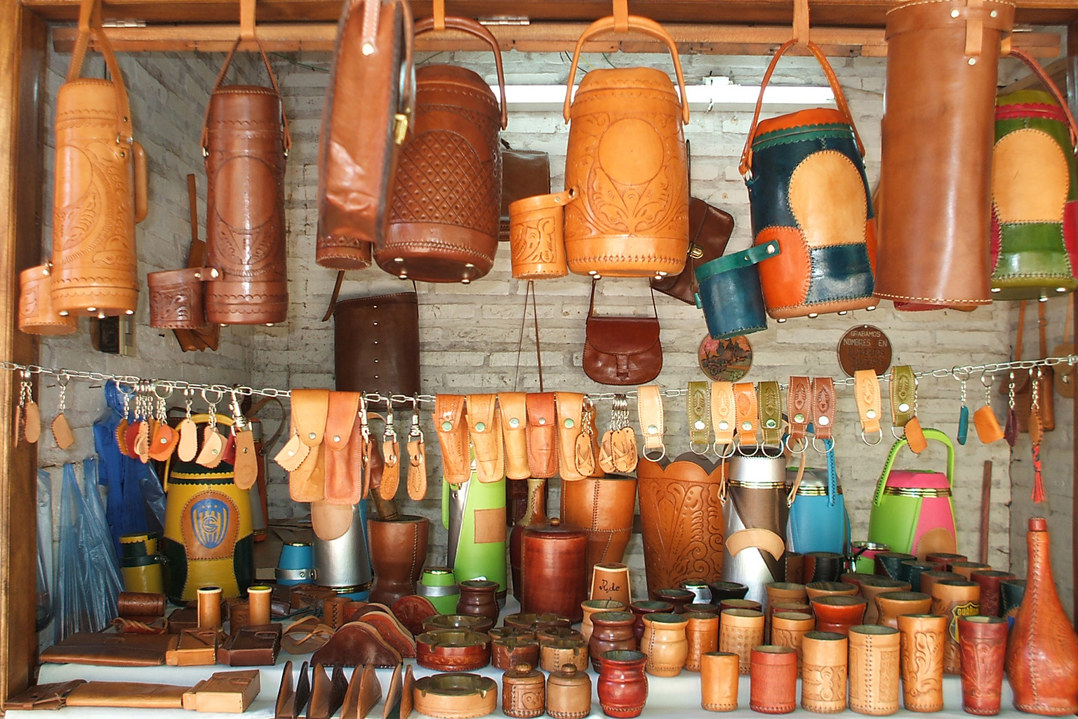 atyra-leather-artisan-paraguay Skilled artisan working with leather in Atyrá, Paraguay, known for craftsmanship and safety