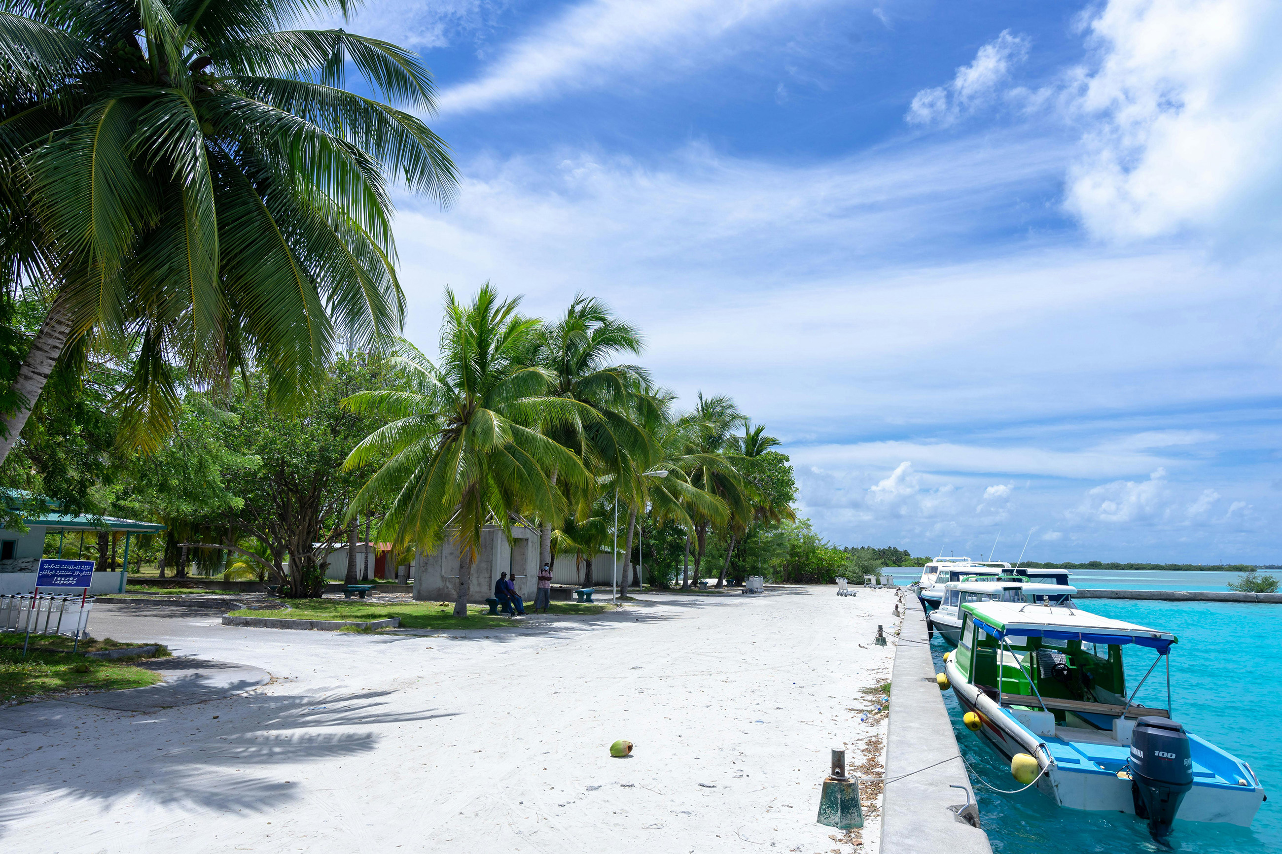 boats tied up dockside at a coastal village in Belize