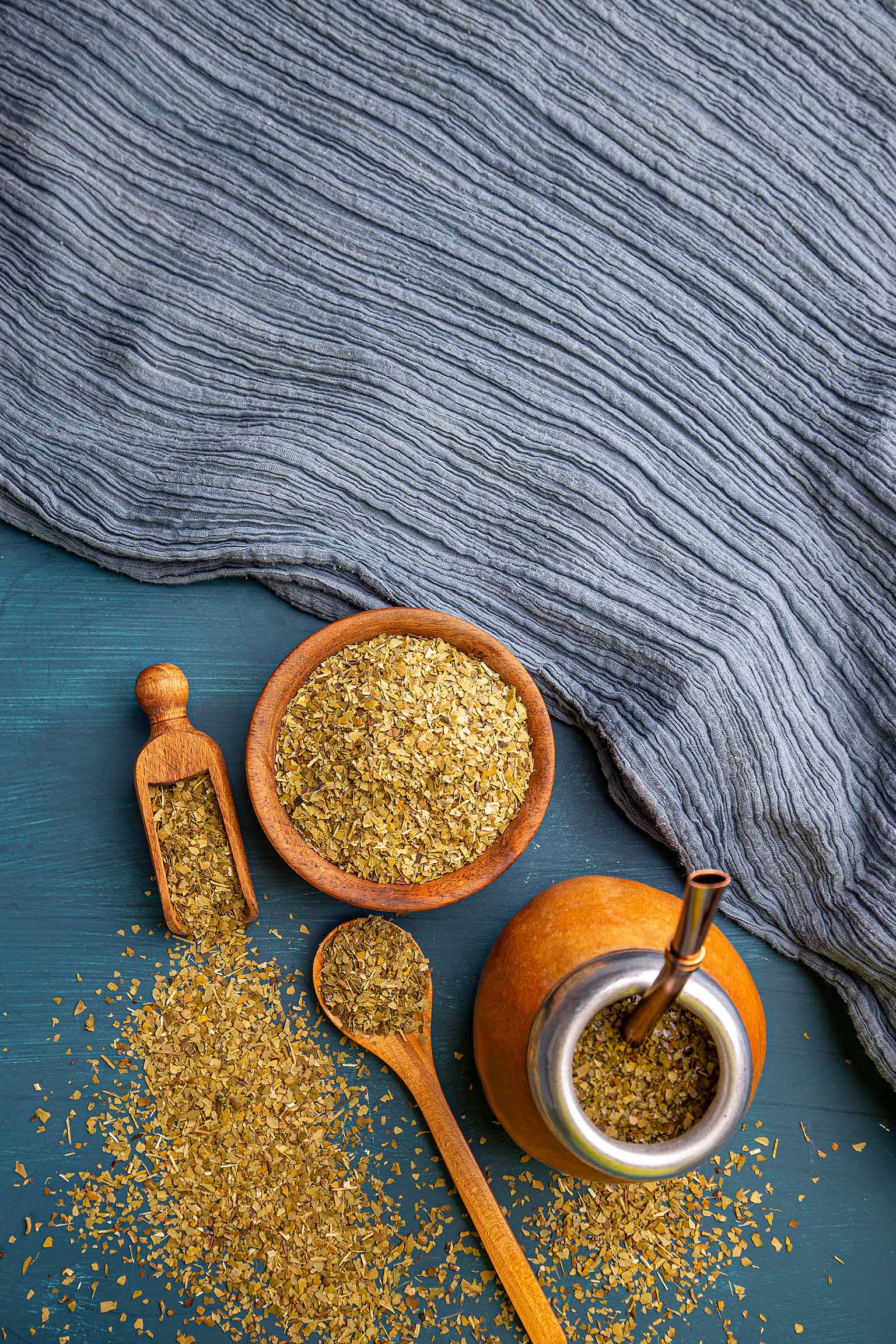 Overhead view of yerba mate served in traditional calabash gourd with bombilla