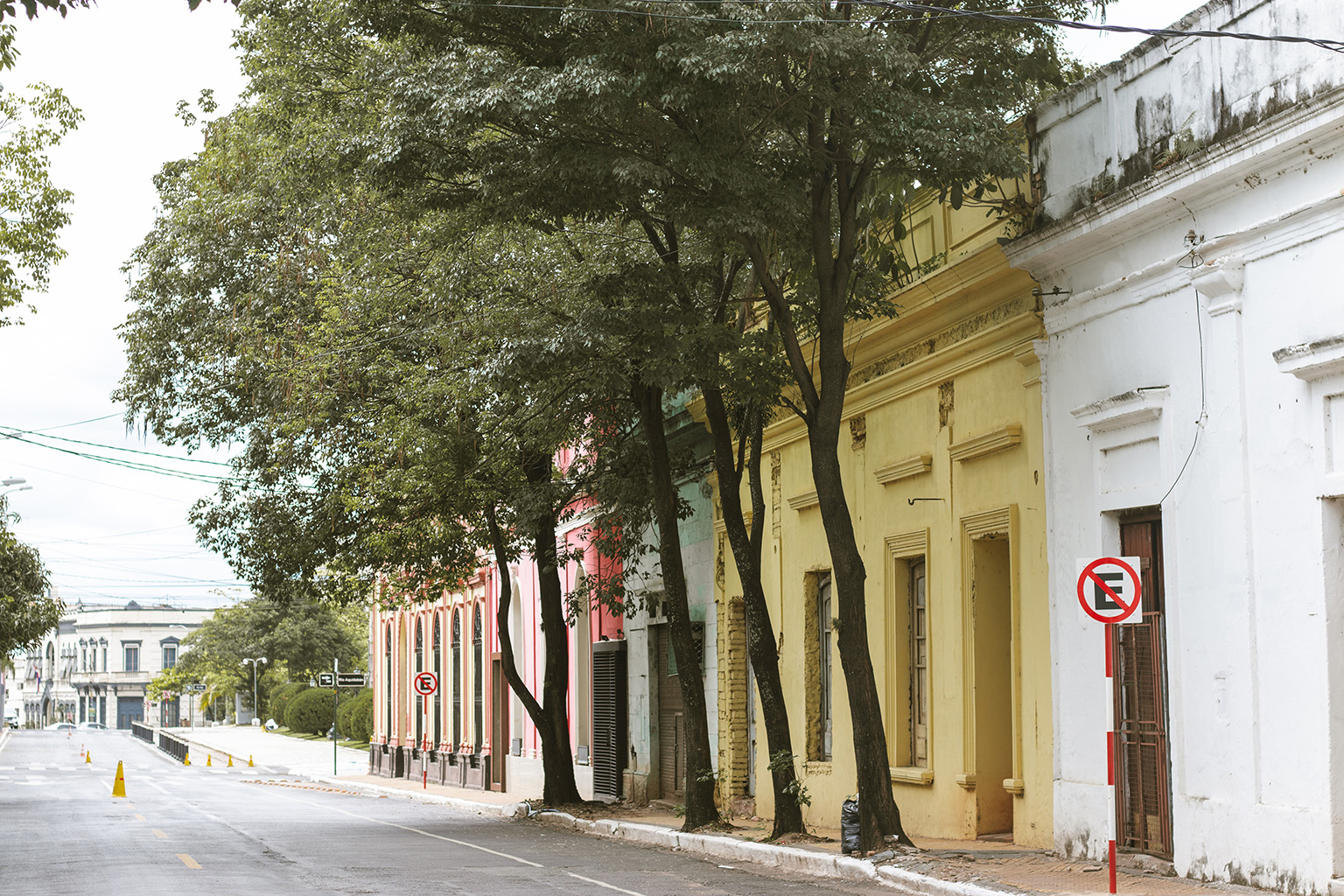 Vibrant colorful buildings lining a street in Paraguay