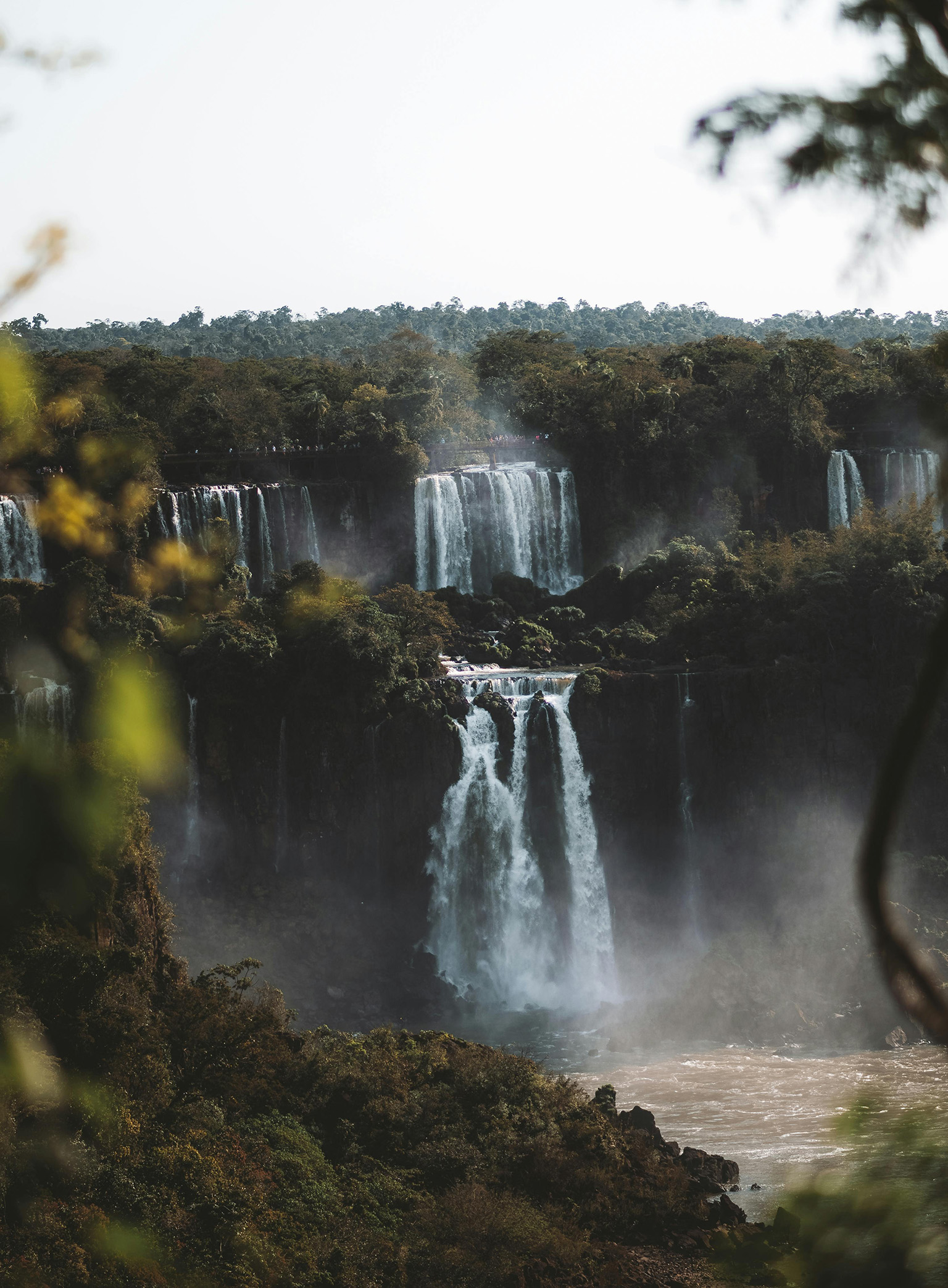 View of Iguazú Falls surrounded by lush rainforest near Ciudad del Este Paraguay.