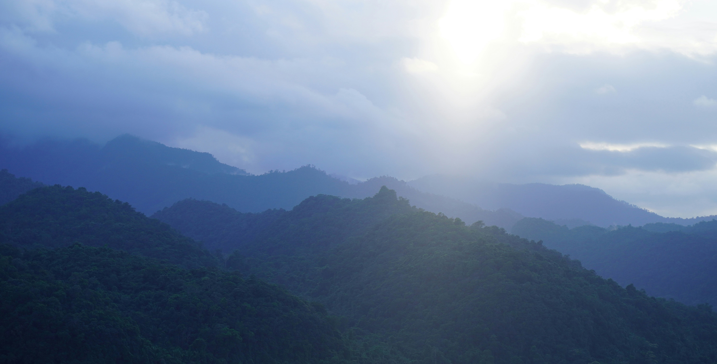 Sunlit inland mountains offering space and privacy for self-reliant living in Belize