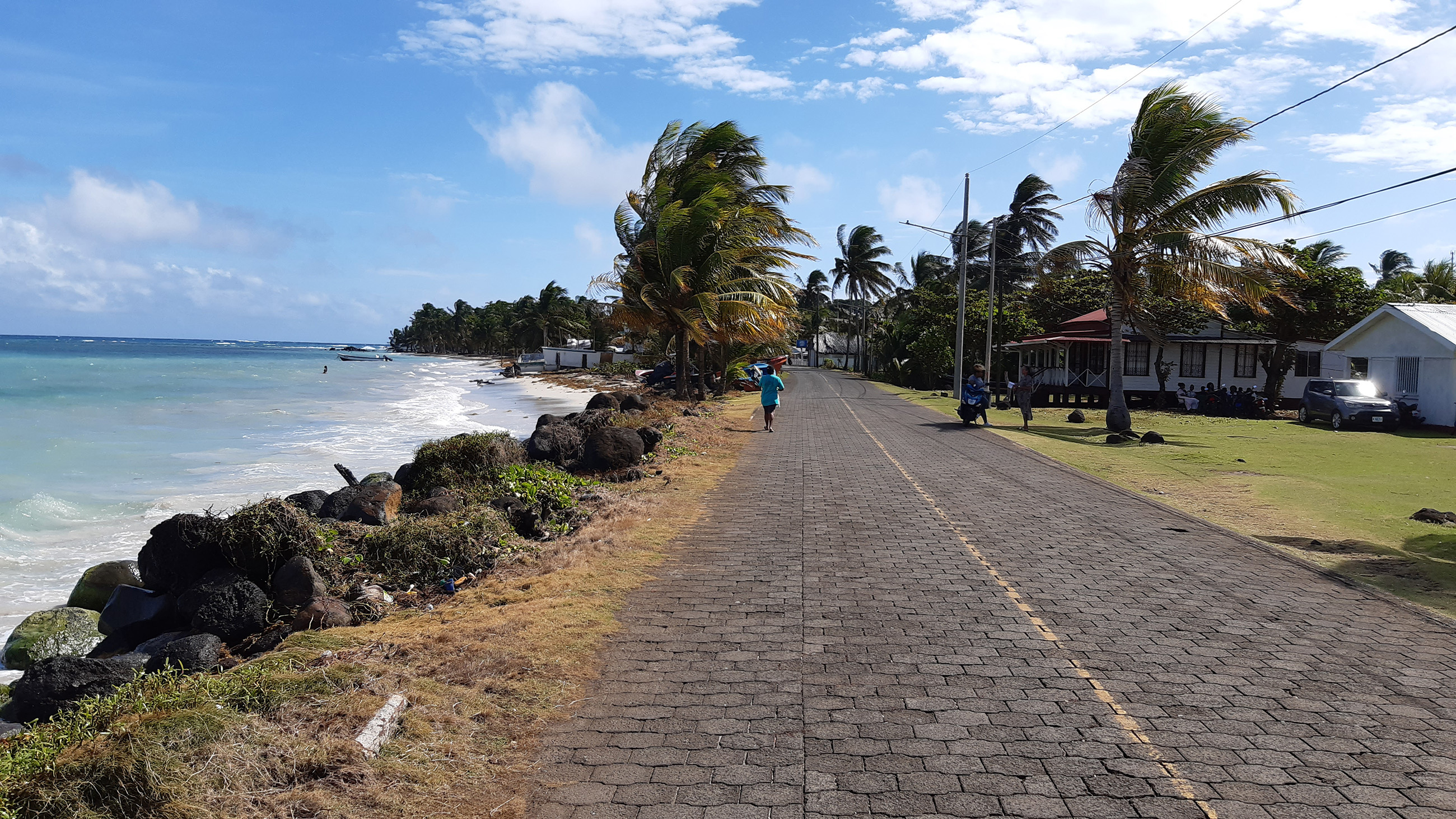 Quiet Caribbean shoreline street with ocean view and neighborhood on Big Corn Island, Corn Islands Nicaragua