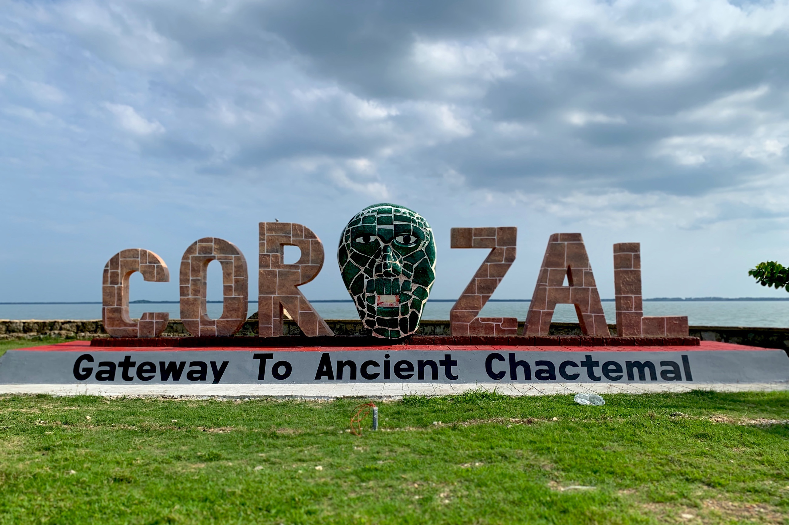 Corozal Belize sign with the sea in the background
