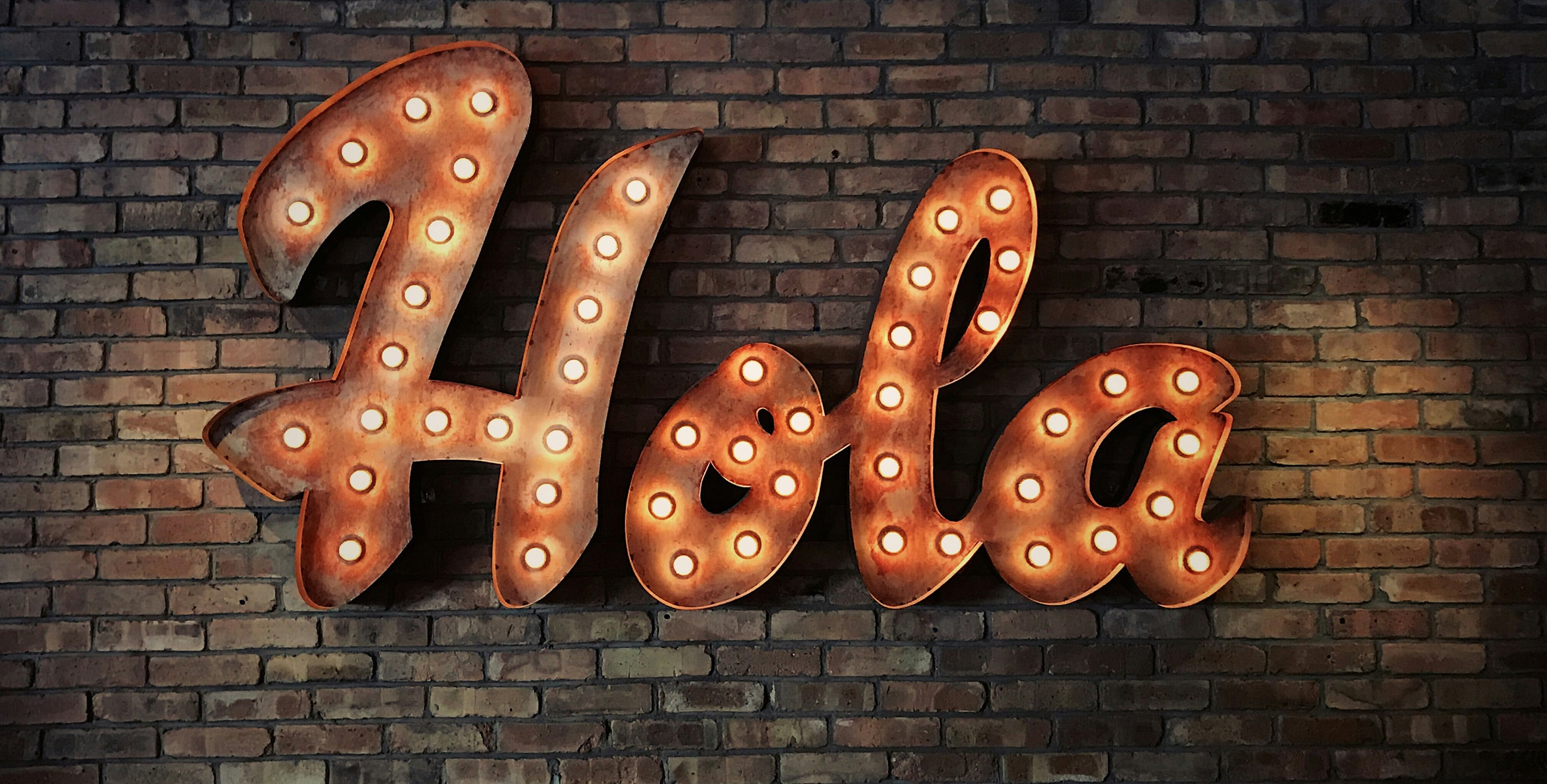 Hola sign symbolizing the language barrier when living in Paraguay without Spanish