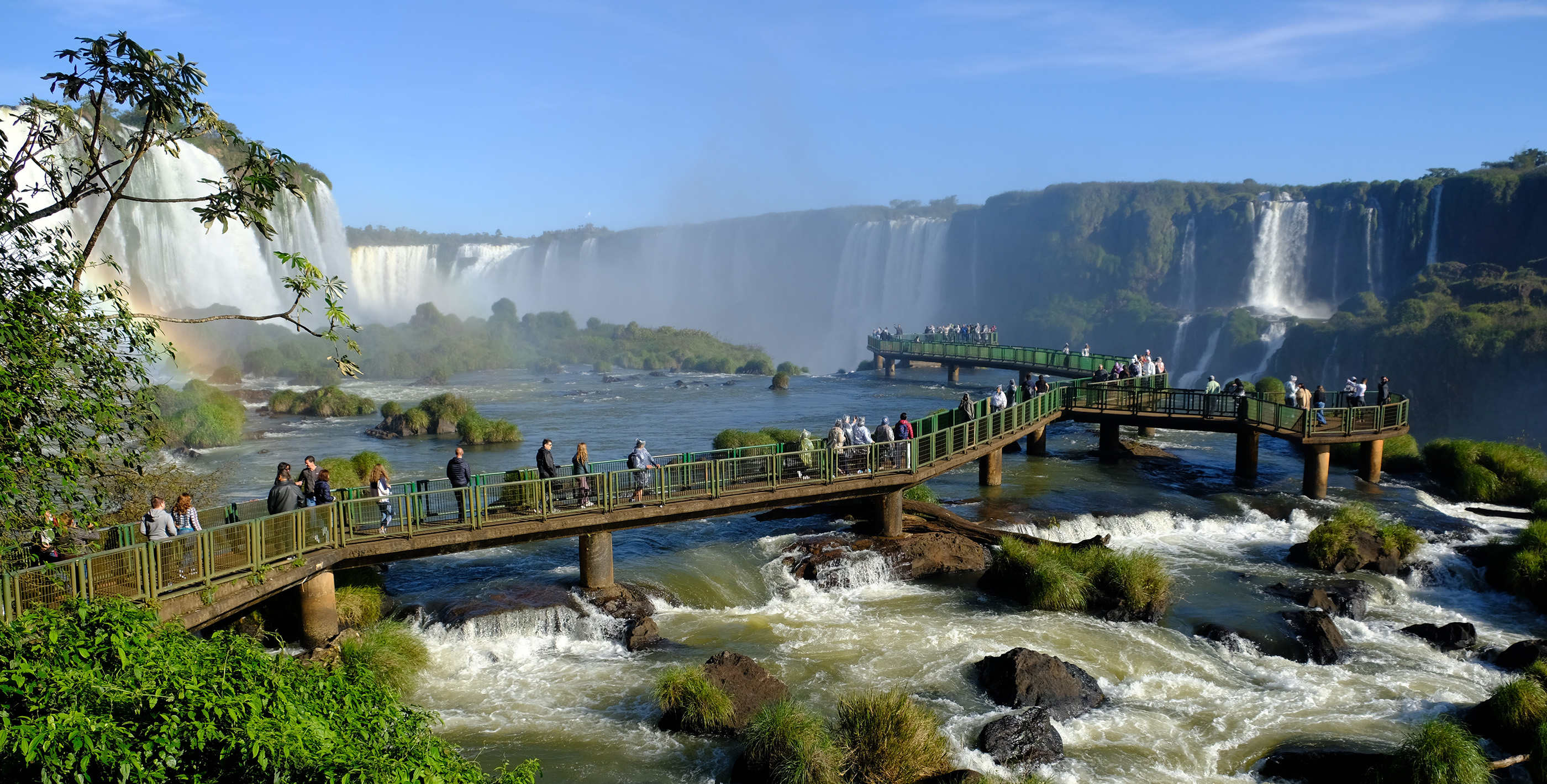 Retired couple enjoying Iguazú Falls while planning how to manage your finances in Paraguay as a retiree