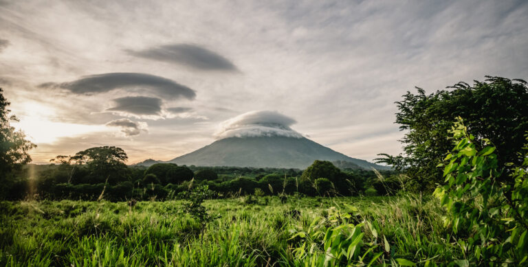 Cloud-covered volcano at sunset in Nicaragua highlighting the country’s natural beauty and relaxed expat lifestyle