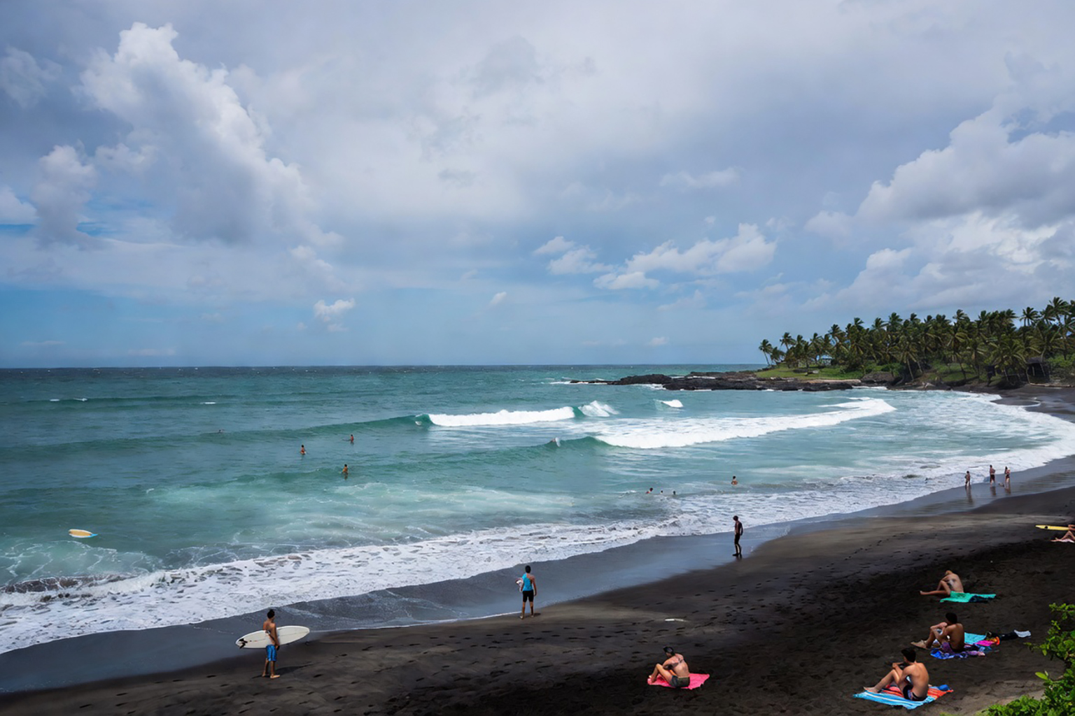 Sunbathers and surfers on San Juan del Sur beach Nicaragua