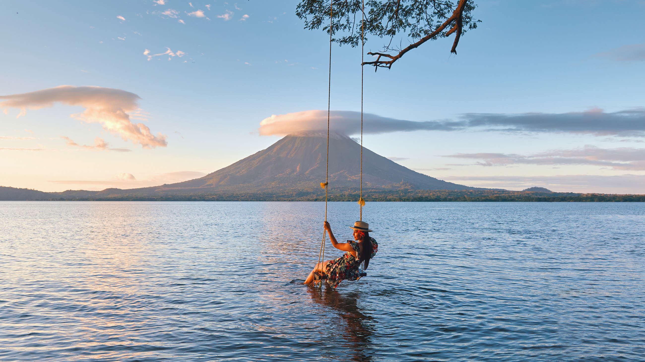 woman-swing-over-water-volcano-nicaragua-slow-pace