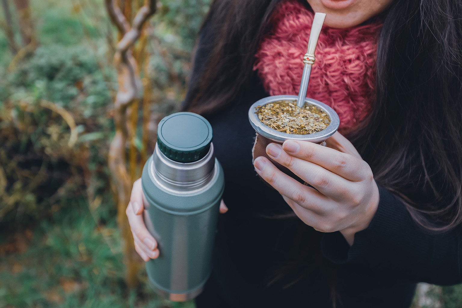 woman drinking yerba mate traditional drink living in Paraguay culture