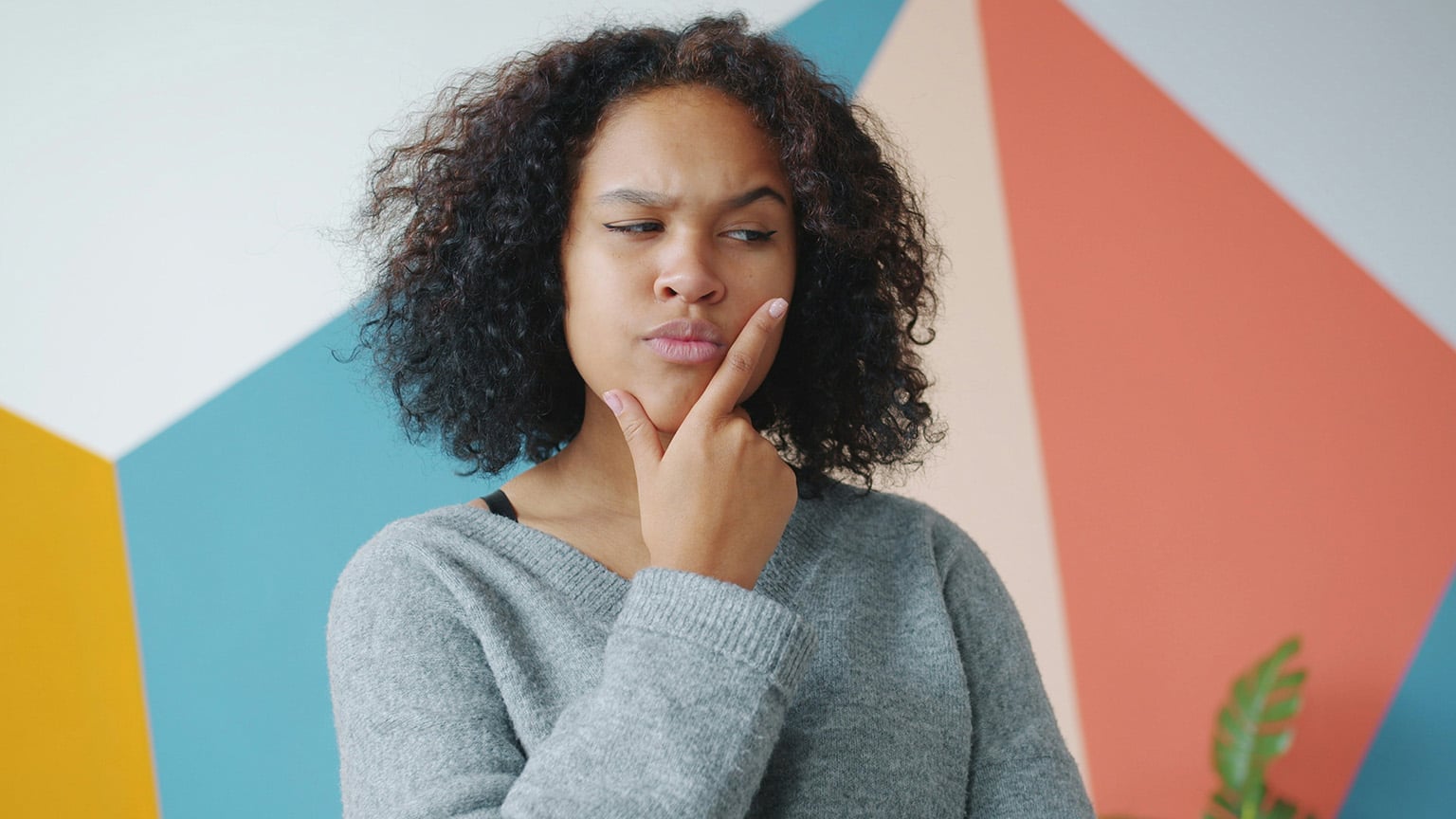 Woman thinking about how banking in Paraguay for foreigners actually works
