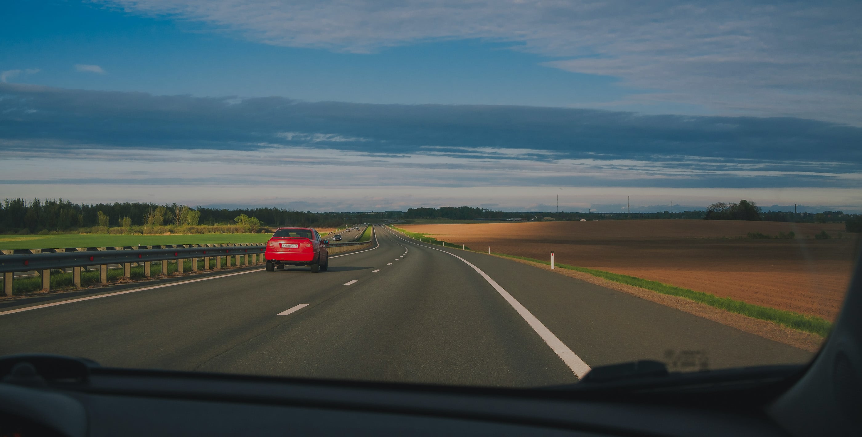 Driving in Paraguay along an open countryside road, view from inside the car