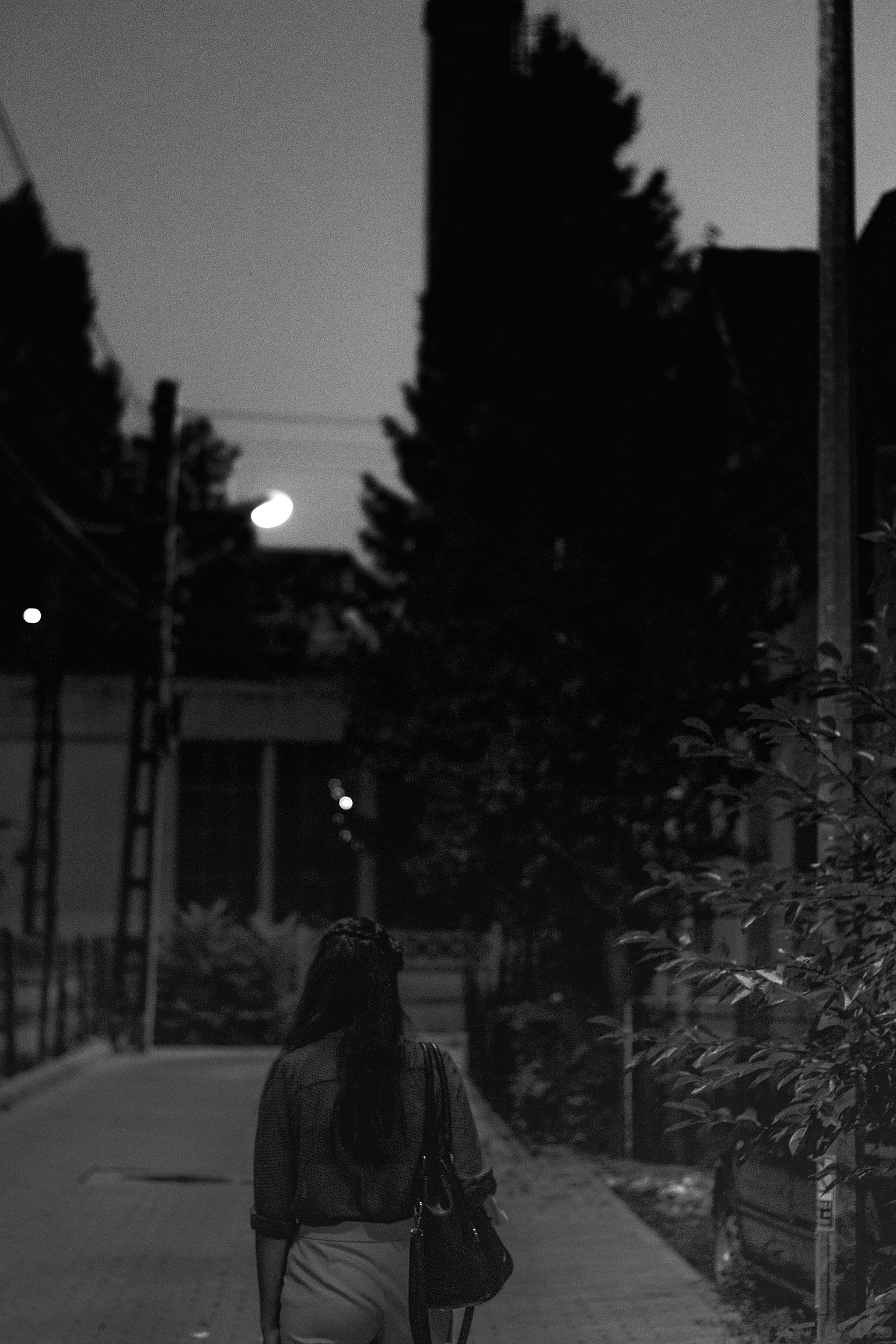 Woman walking alone on a Paraguay street at night