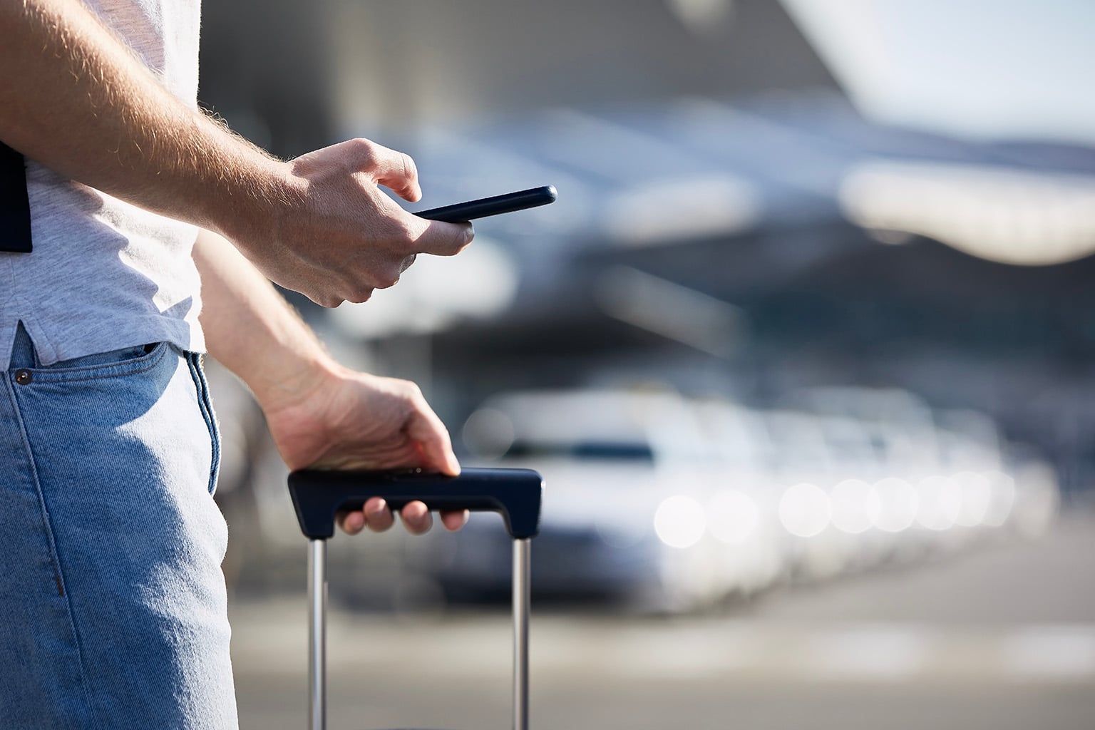 Man ordering a rideshare through his phone app, an alternative to driving in Paraguay 