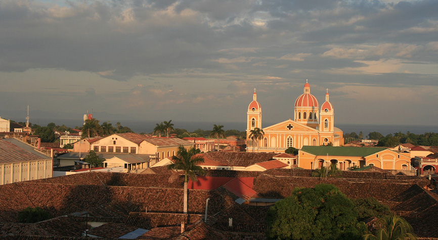 Granada cathedral and colorful rooftops showcasing the historic neighborhoods